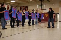 Theater students and faculty from Illinois Valley Community College perform a skit written by a student at Peru Catholic School. Several skits were performed based on poems and plays written by Peru Catholic students at the conclusion of a year-long
