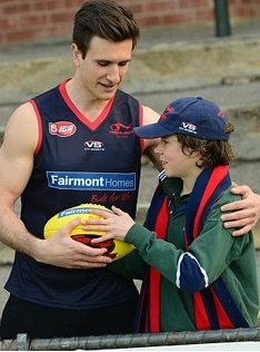 Playing for a cause: Norwood player Matt Panos with Mitchell Neagle, 15, who has autism. Mitchell’s dad is former Redlegs premiership player and Dignity for Disability party president Rick Neagle. Picture: Mark Brake Source: News Limited