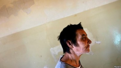 FILE - A patient is seen walking toward a group therapy room at a mental health facility in the Balkans. Depression is now the leading cause of global mental and physical disability, a WHO study finds.