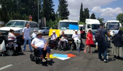 Dozens of disabled Israelis block Highway 1, the road from Tel Aviv to the Airport, June 21, 2017.  read more: http://www.haaretz.com/opinion/editorial/1.810429