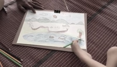 เด็กชายพิสิษฐ์ นารี หรือน้องยูโร อายุ 9 ปี เด็กนักเรียนชั้นประถมศึกษาปีที่ 2 เรียนศิลปะใช้เท้าวาดรูป